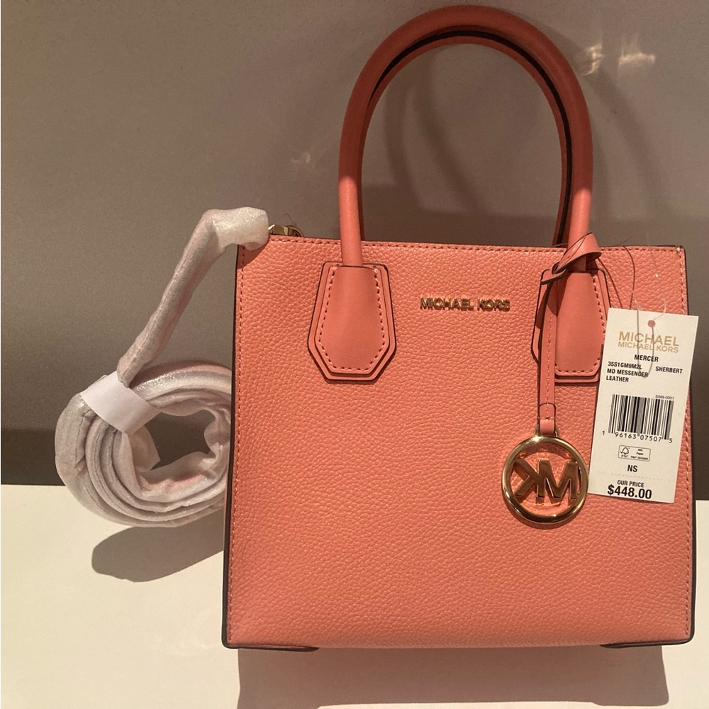 Brand new, bright light pink Michael Kors handbag, midsize, with tag (448$)